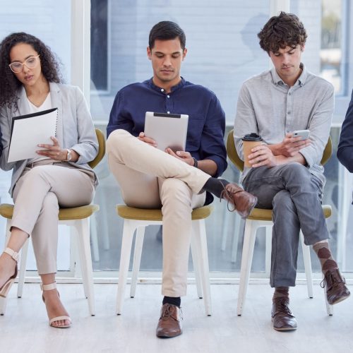 Office, business people and waiting in row for recruitment, interview and corporate meeting. Candidates, notes or information for preparation, remember and memory for hiring position in workplace.